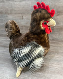 Side standing view of weighted rooster plush with soft brown body and realistic feathered wings.