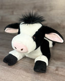 Three-quarter front view of a weighted Holstein cow plush handmade for calming sensory support.