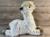 24-inch jumbo weighted llama plush with shaggy cream fur, smiling face, long neck, and floppy legs stretched out in a sitting pose.