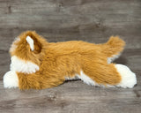 Weighted Pomsky stuffed dog lying down, side view showing fur texture.