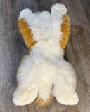 Bottom view of weighted Pomsky plush showing full-body design