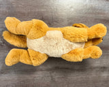 Bottom view of weighted Golden Retriever plush showing floppy body and paws