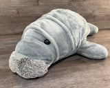 Front angled view of the weighted Mama Manatee plush highlighting its realistic face and cuddly, floppy design