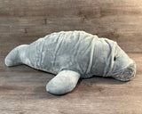 Side view of our 32-inch weighted Mama Manatee plush showing its broad, floppy body and soft textured wrinkles