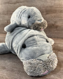 Baby weighted manatee riding on the 32-inch Mama Manatee plush in a matching weighted plush pair