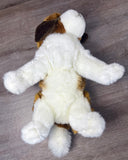 15-inch Weighted St. Bernard plush laying on it's back showing it's underside body and legs.