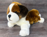 15-inch St. Bernard weighted stuffed animal lying with head cocked.