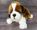 15-inch weighted St. Bernard plush laying front-side view with head tilted to one side.