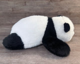 Black and white full-body weighted panda plush, side view