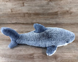 22-inch blue weighted shark plush lying on its side