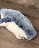 Close-up of soft blue weighted shark plush with teeth