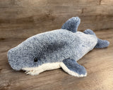 Blue and white weighted shark stuffed animal, angled side view
