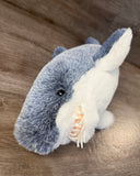 Close-up of weighted shark plush face showing soft teeth and white belly