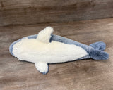 Underside of blue and white weighted shark plush showing full body
