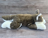 22-inch brown and white weighted Husky stuffed animal lying flat, side view