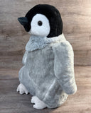Side profile of 20-inch gray weighted penguin stuffed animal with black and white face, soft floppy wing, and plush rounded belly.
