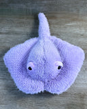 Front view of 20-inch lavender weighted stingray plush with 15-inch wingspan, fluffy purple body, and long soft tail.