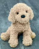 Curly tan doodle dog plush, front portrait with black nose and glass eyes