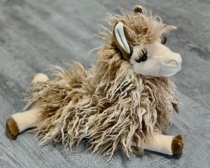 15-inch weighted llama plush with shaggy tan fleece, long lashes, and floppy legs in a relaxed laying pose.