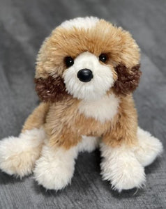 15-inch weighted Goldendoodle plush with fluffy cream-gold coat, sitting on gray wood surface