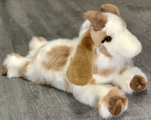 Realistic white goat with brown spots, brown eyes, long curly eyelashes, weighted stuffed animal in a floppy laying position. 